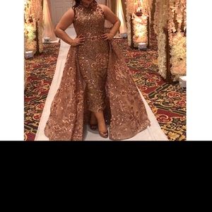 Beautiful detailed couture evening gown with cape